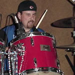 image of Randy playing drums